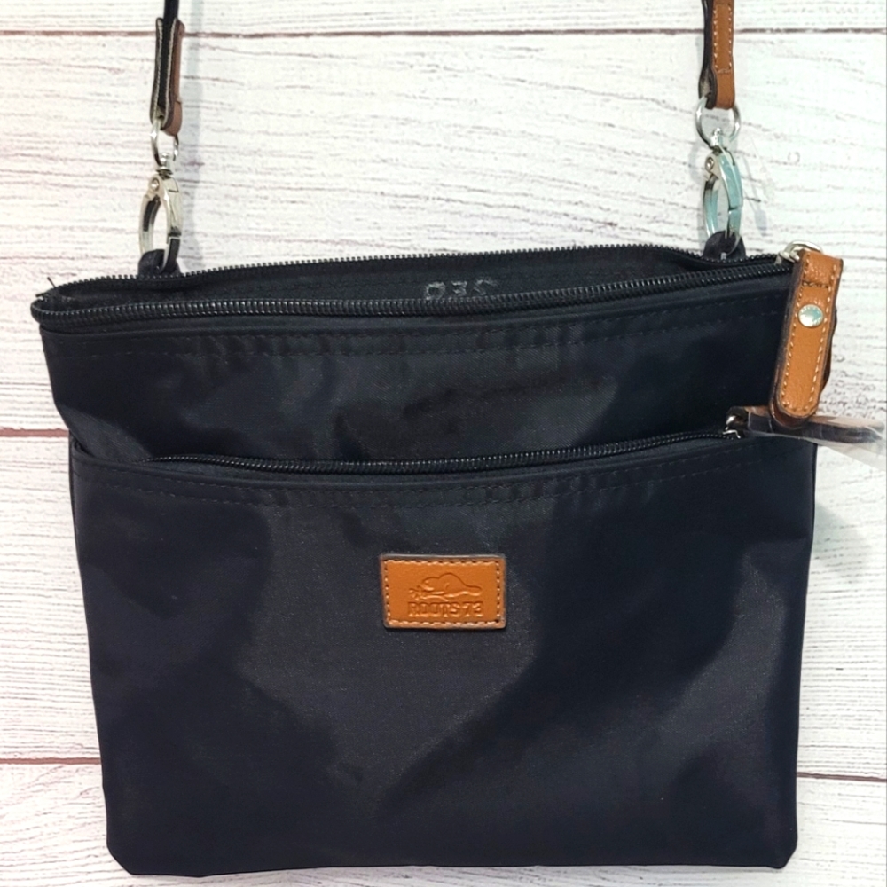Nwot Roots nylon crossbody with leather accents Lightweight And Very Practical